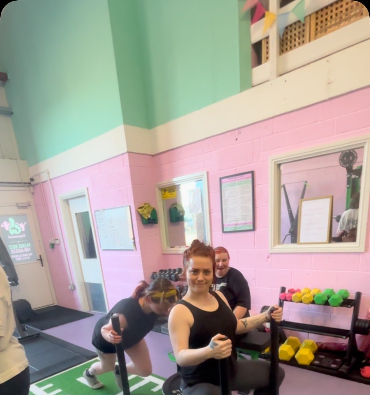 A group session in the studio with pink and mint walls