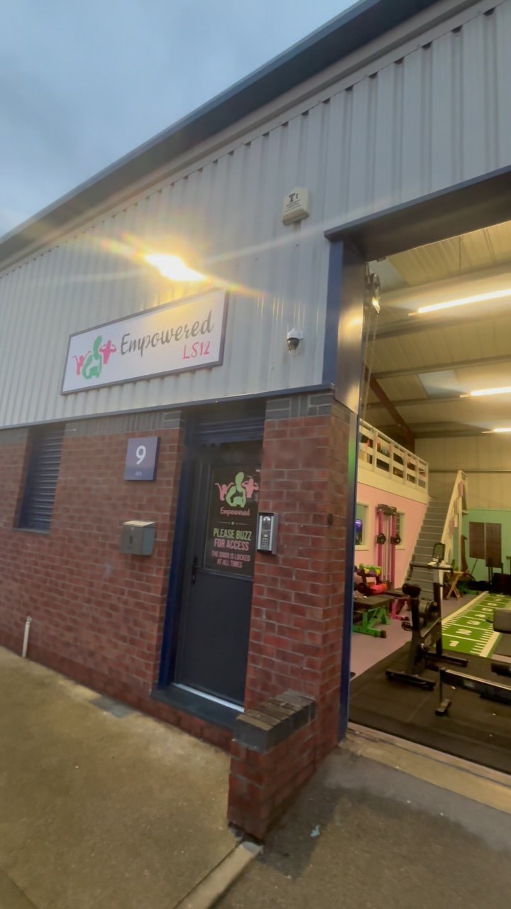 The outside of Unit 9 with the Empowered sign over the entrance